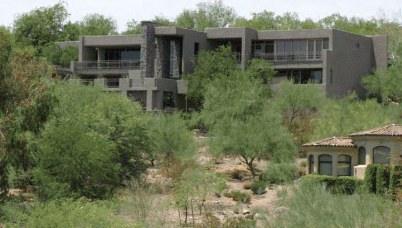 Contemporary home stepping down a desert hillside