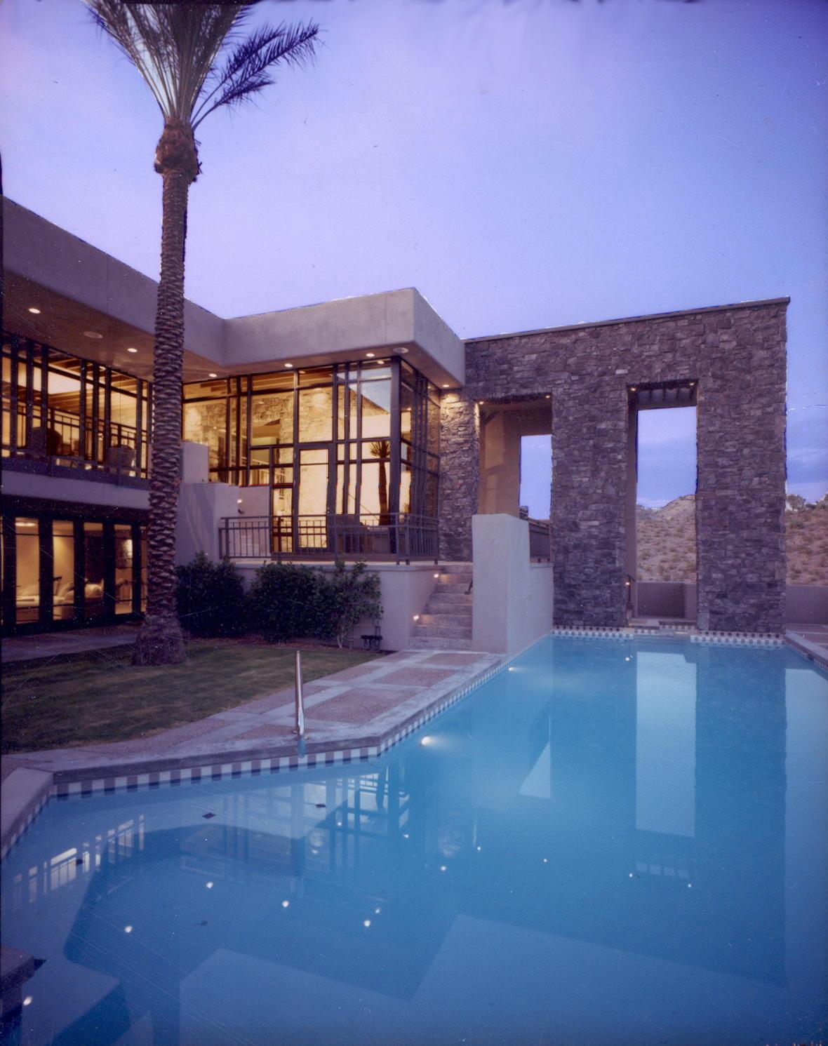 Courtyard pool with desert masonry arch