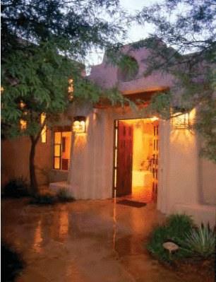 Entry courtyard at dusk after rain