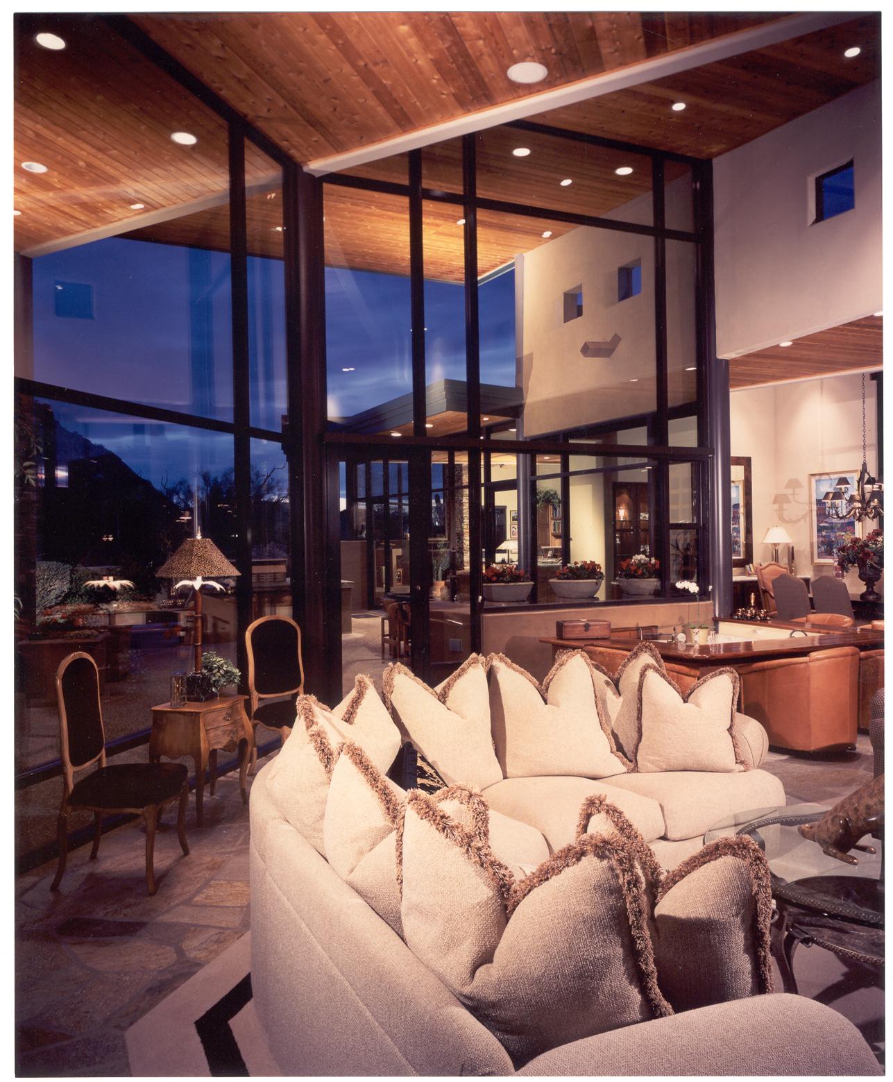 Great room with floor-to-ceiling glass and desert views